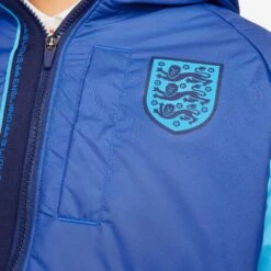 Nike Men's England Winterized Full Zip Jacket - Game Royal/Blue Void/Blue Fury 10 Nike Men's England Winterized Full Zip Jacket - Game Royal/Blue Void/Blue Fury -Daily Flex Shop DH4889 480 PHSYM003 2000