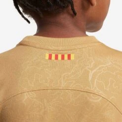Youth Nike FC Barcelona 2022/23 Away Jersey - Club Gold/Obsidian -Daily Flex Shop fc barcelona 2022 23 away little kids soccer kit PBZSkQ 1